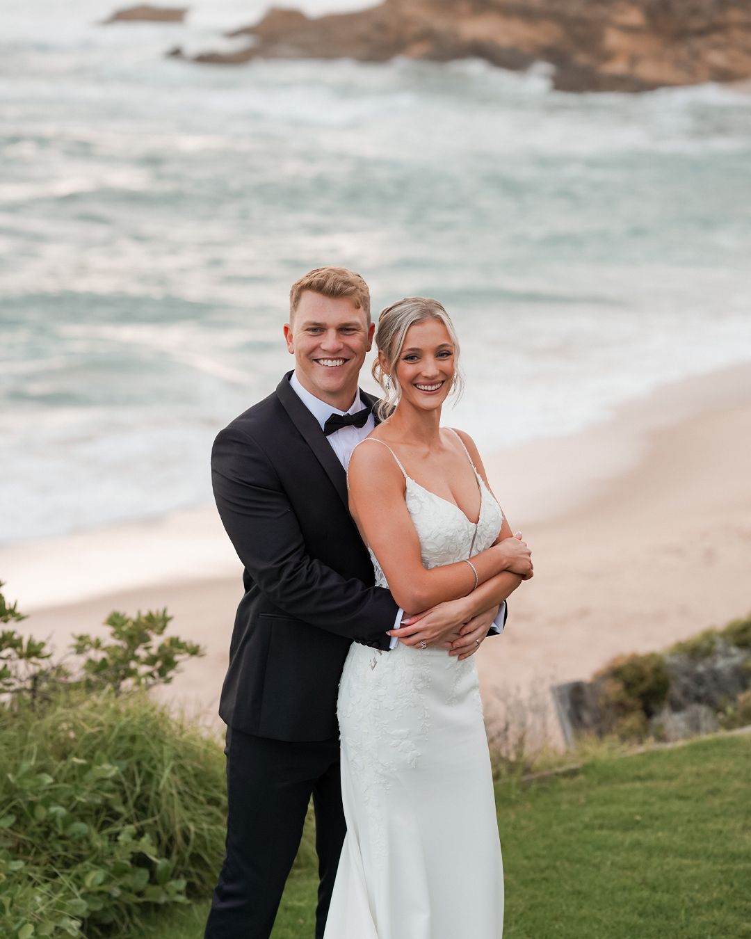 Newly married couple by the sea